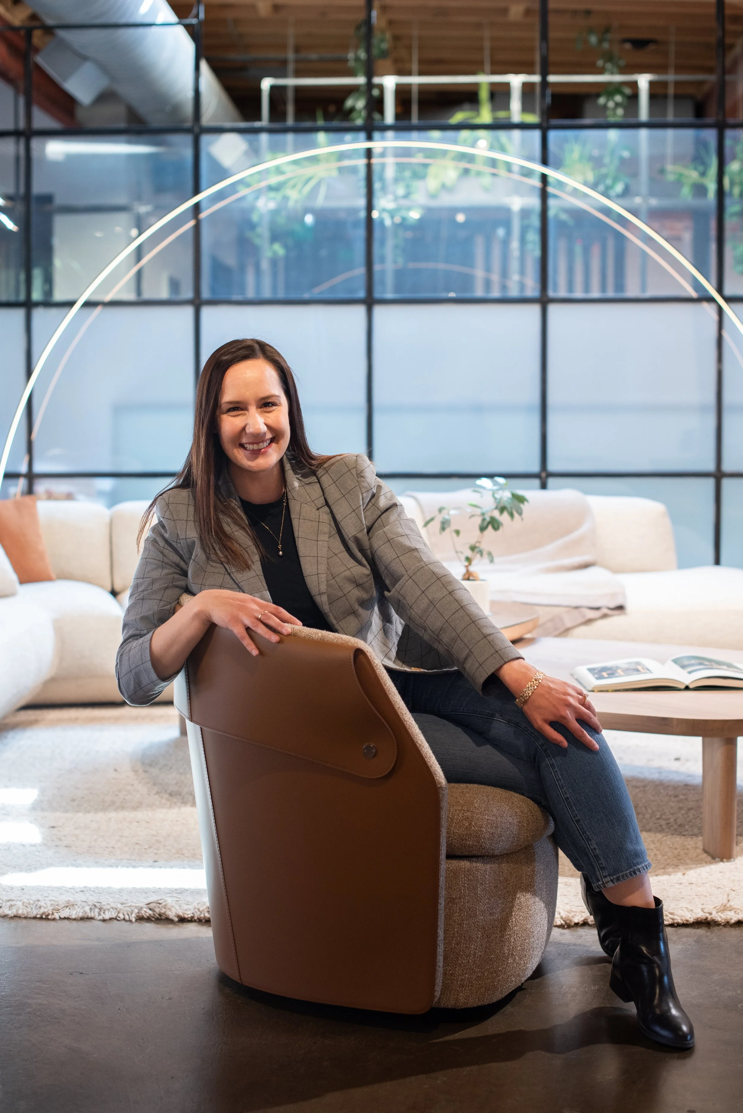 A principal designer of Jade Collective Interiors photographed in the studio