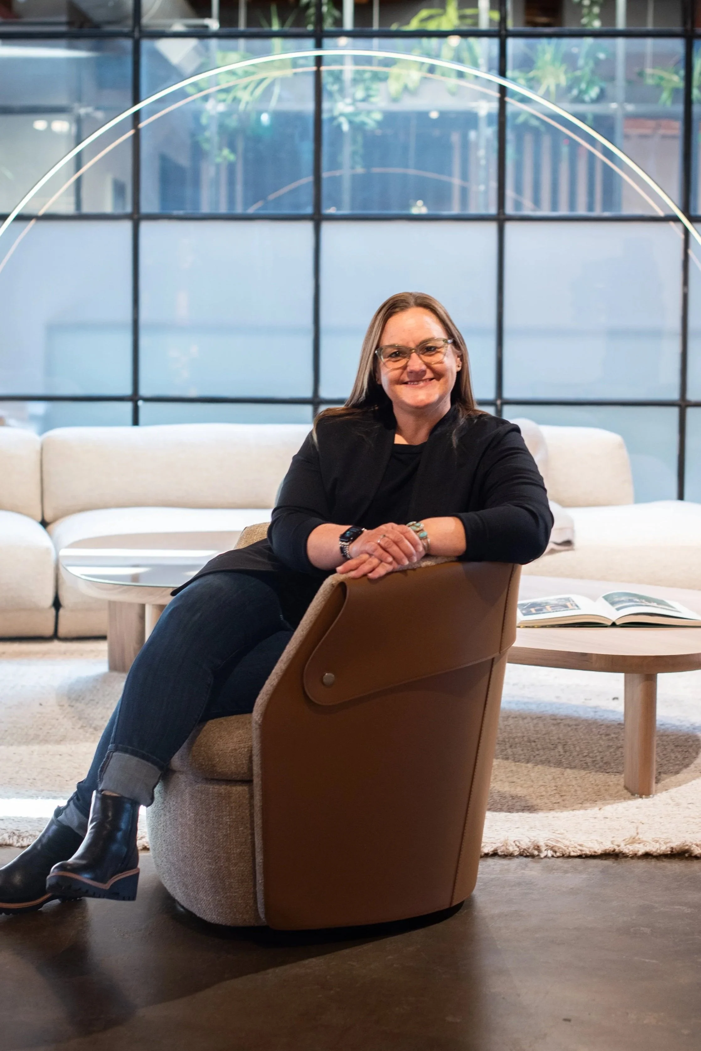 A principal designer of Jade Collective Interiors in the studio showroom